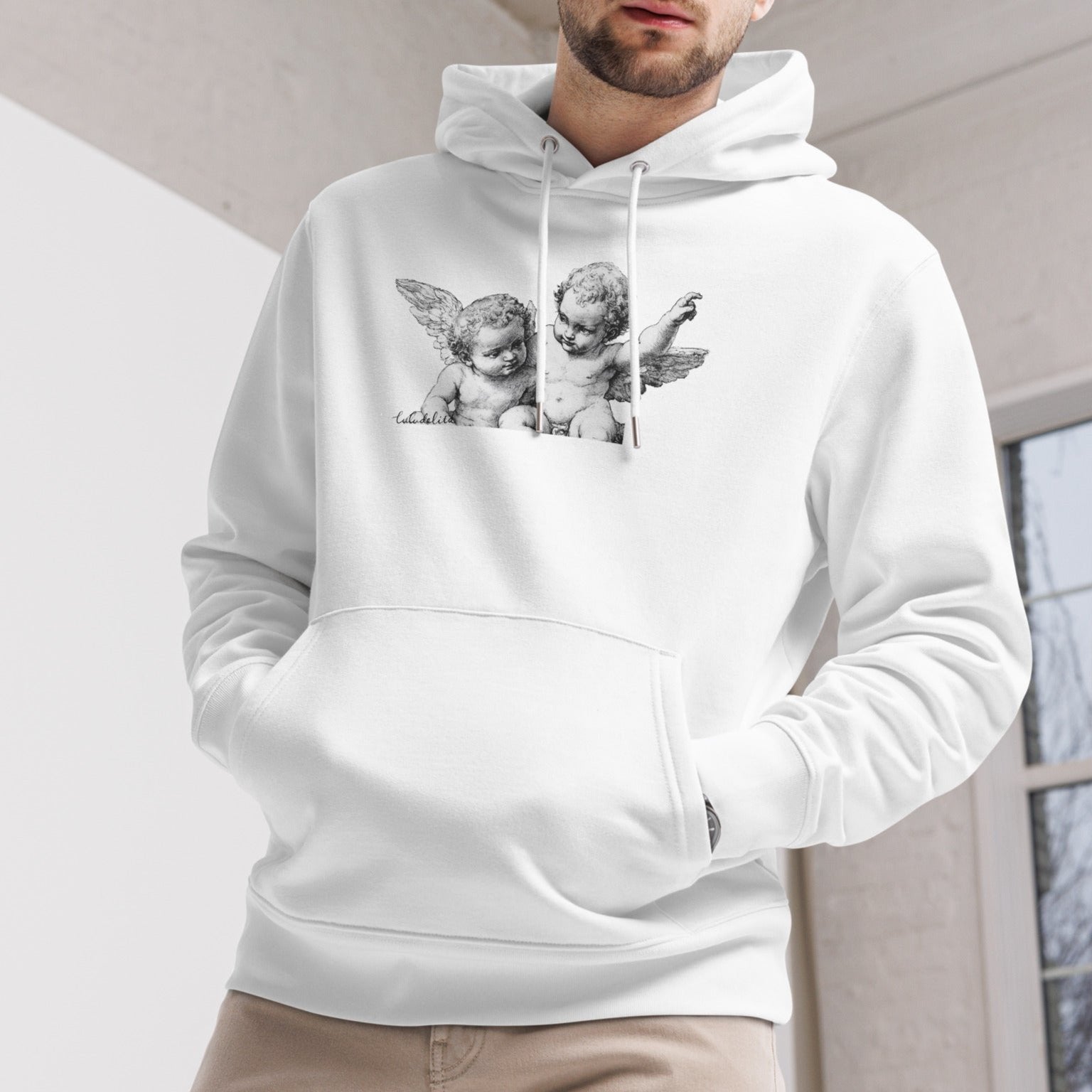 Male model wearing a white hoodie with angels print in front